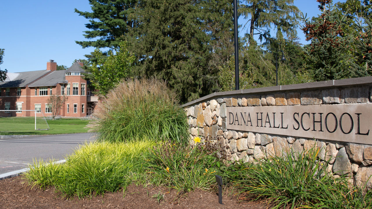 Stone wall with Dana Hall carved on it