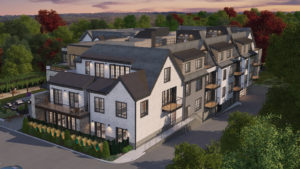 View of side and rear of Bristol Wellesley luxury condominiums, gray and white building, patios and decks visible.