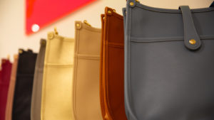 yellow, orange and gray leather purses