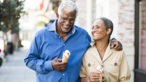 Middle aged Black couple enjoying ice cream cones